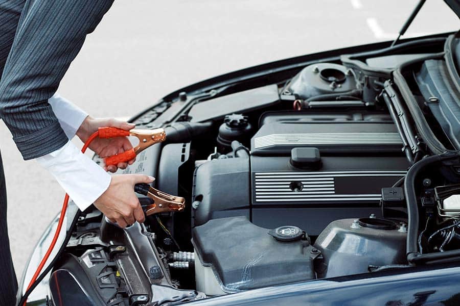 Woman Jumping Her Car Battery