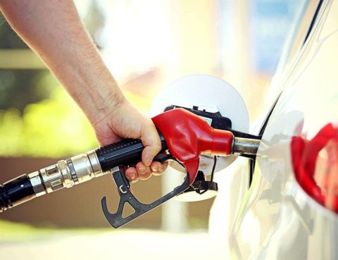 Man Filling up car with gas
