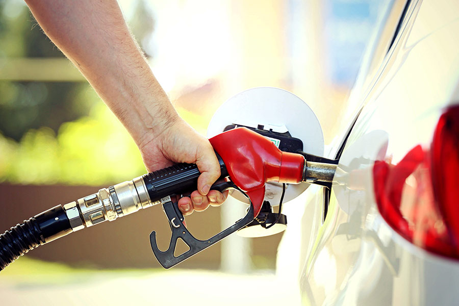 Man Filling up car with gas