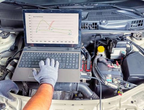Mechanic Performing a Car Diagnostic Test