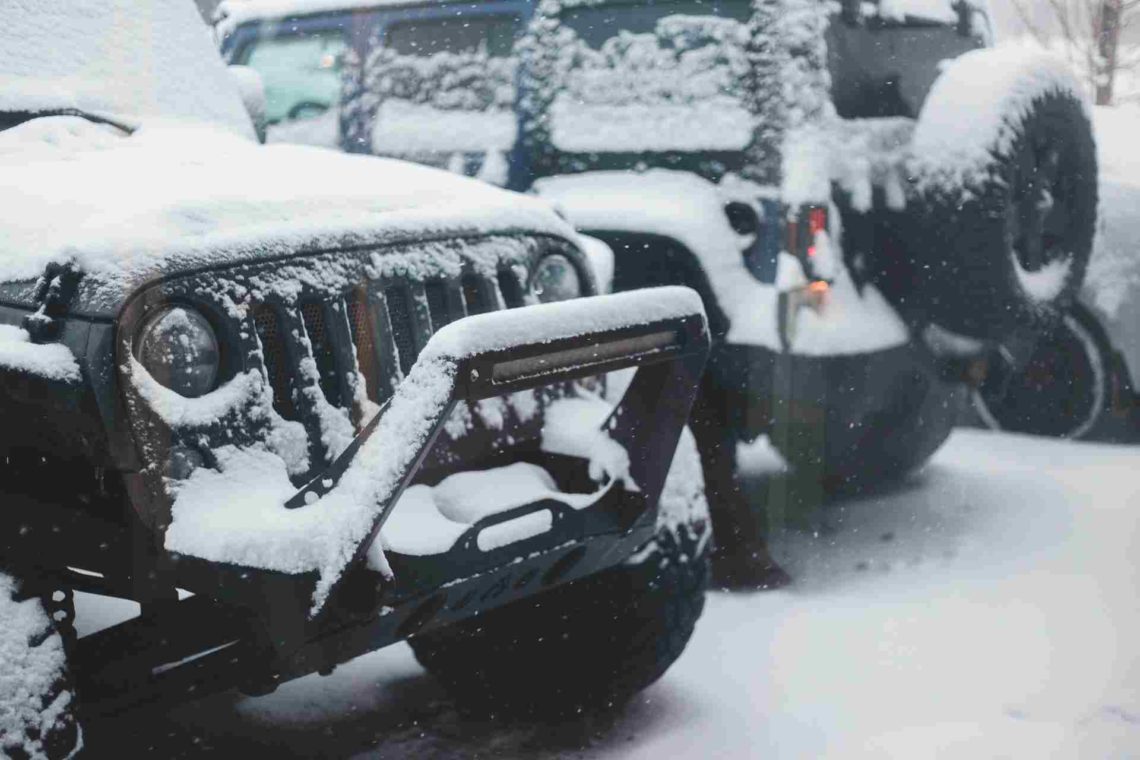 Jeeps covered in snow in the winter