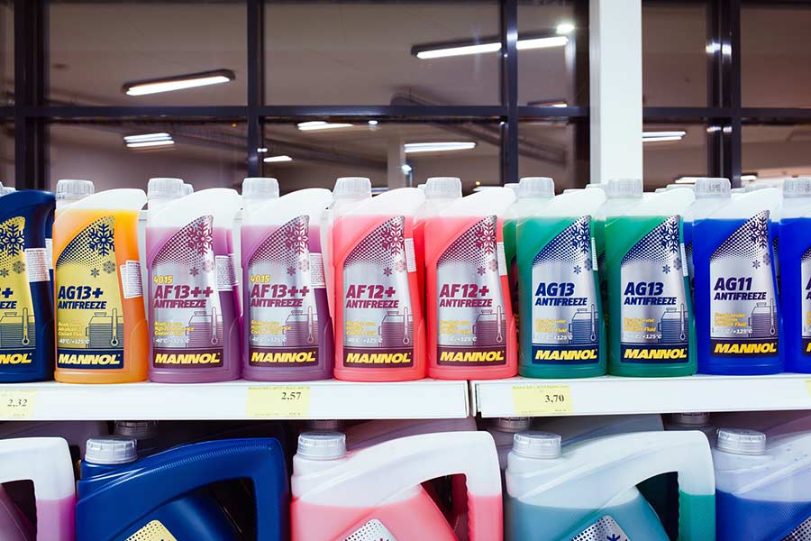 Antifreeze jugs on an auto parts store shelf