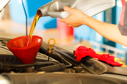 oil change being performed on vehicle