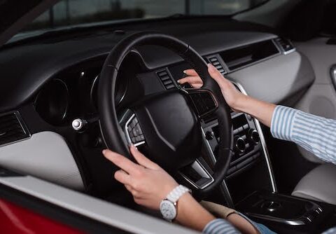 woman driving a car with power steering